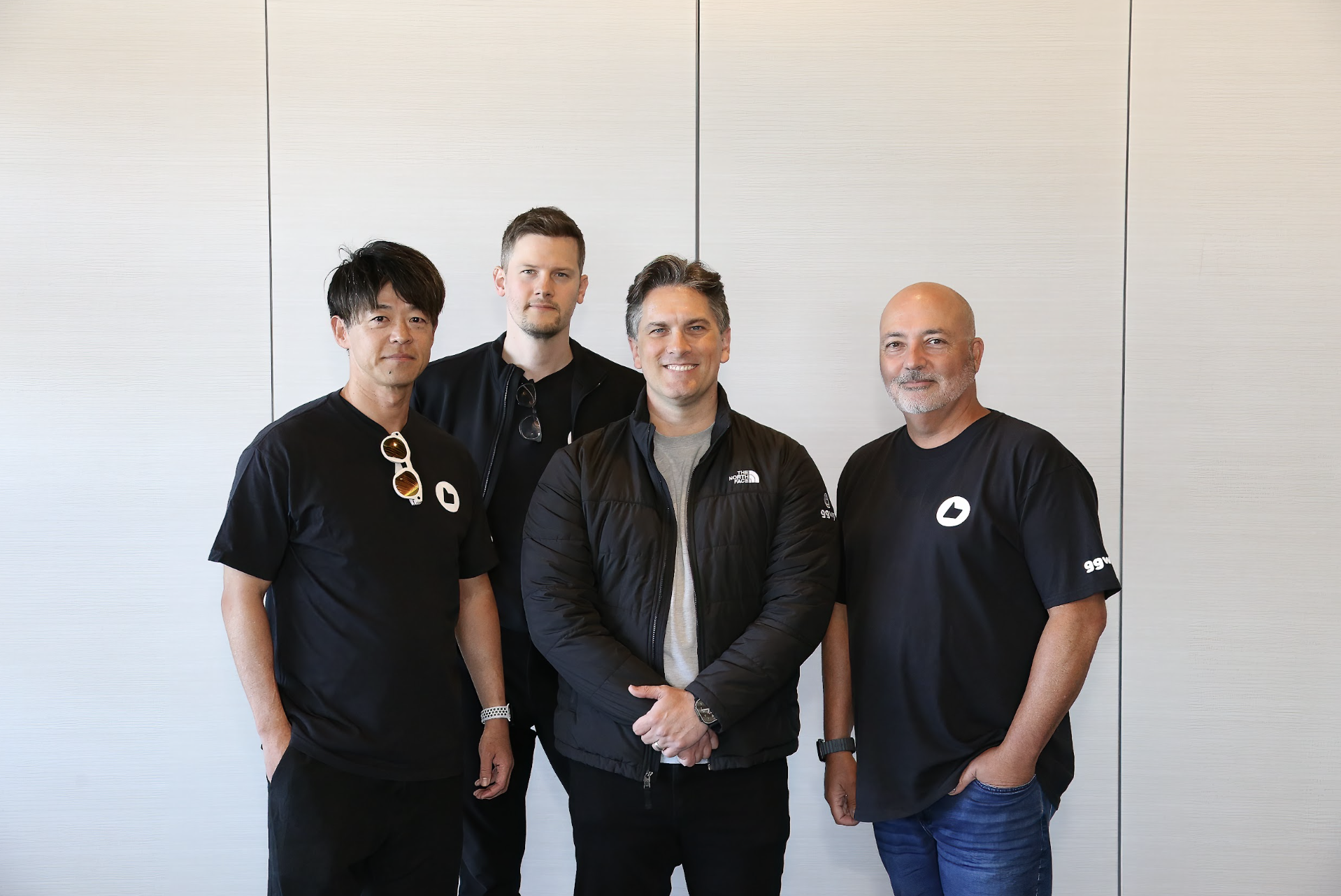 Four members of the GGWP team standing together in the office